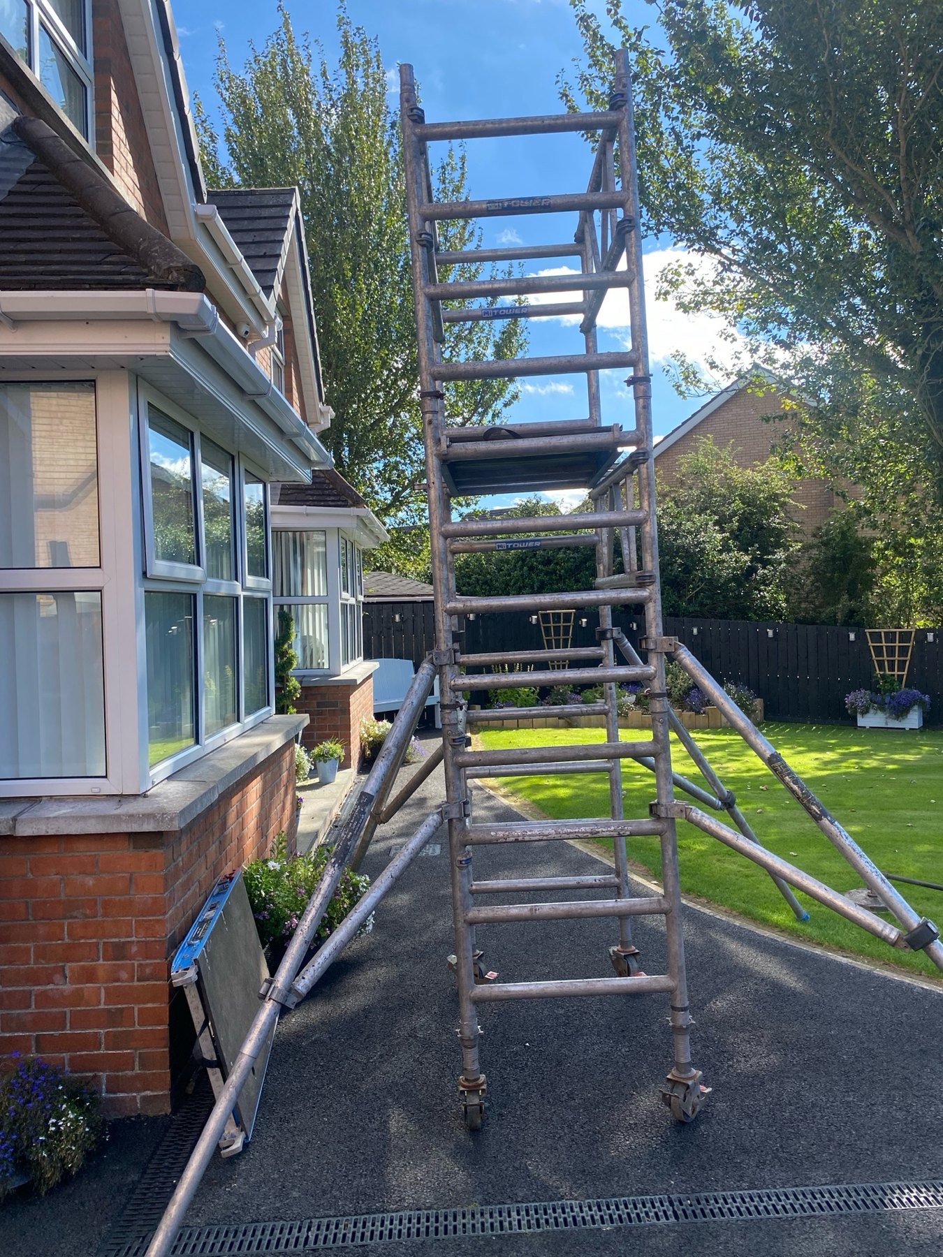 Access equipment set up beside a house for roof work